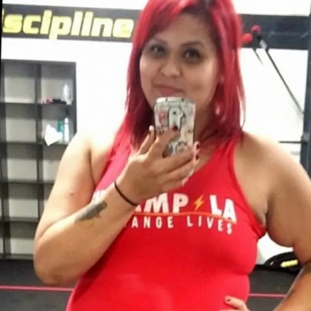 The same member after training at FitCampLA, in a We Change Lives tank